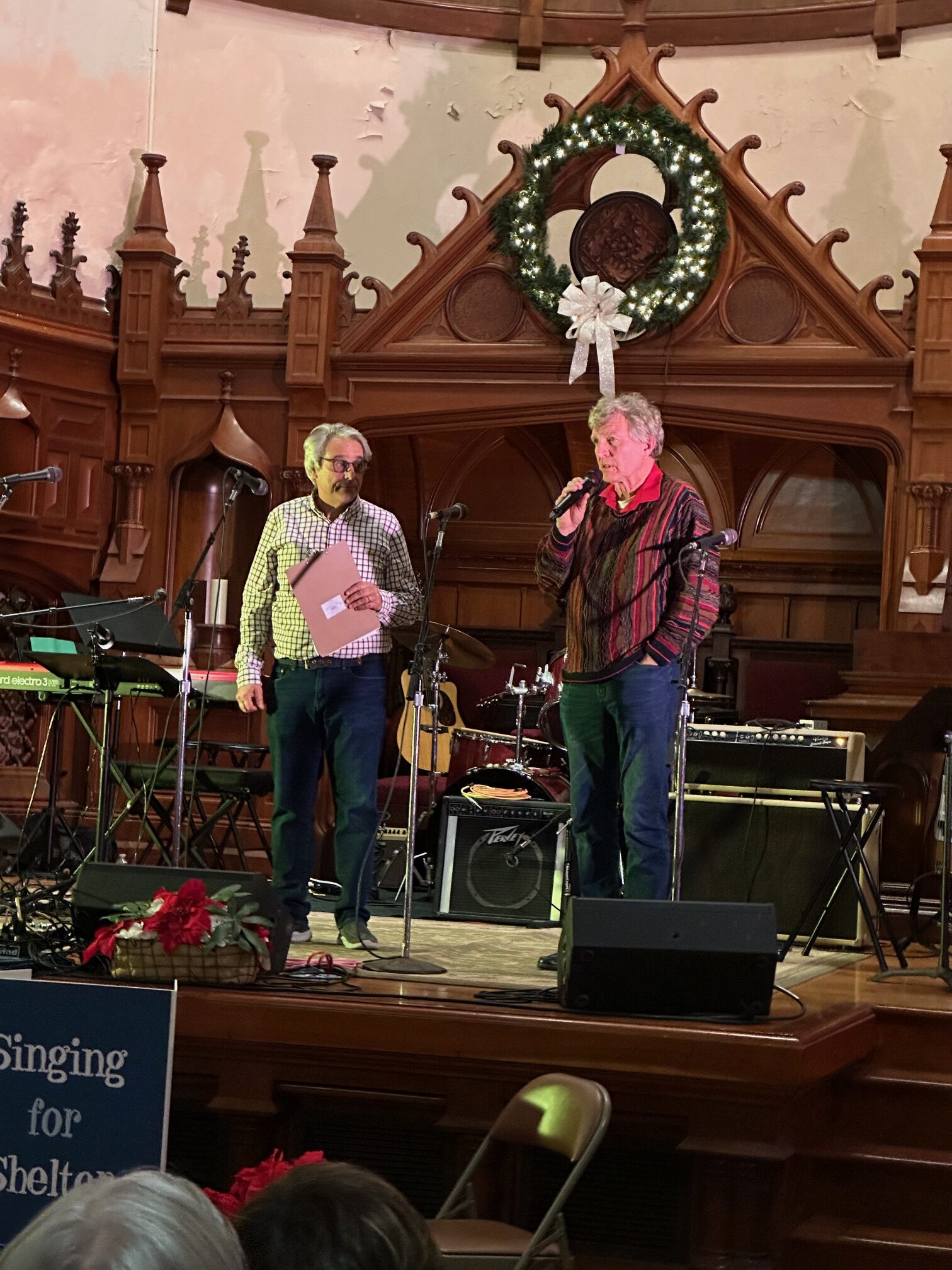 Singing for Shelter, December 2023. A skeptical Mark looks in as I ask for computer donations.